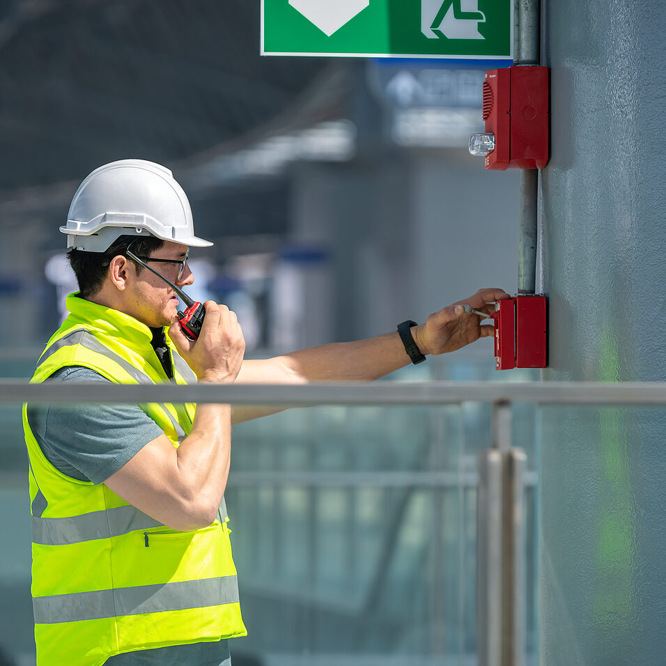 Engineer Wearing Safety Uniform And Helmet Under Checking Fire E FIRE & SECURITY SYSTEMS & SUPPORT